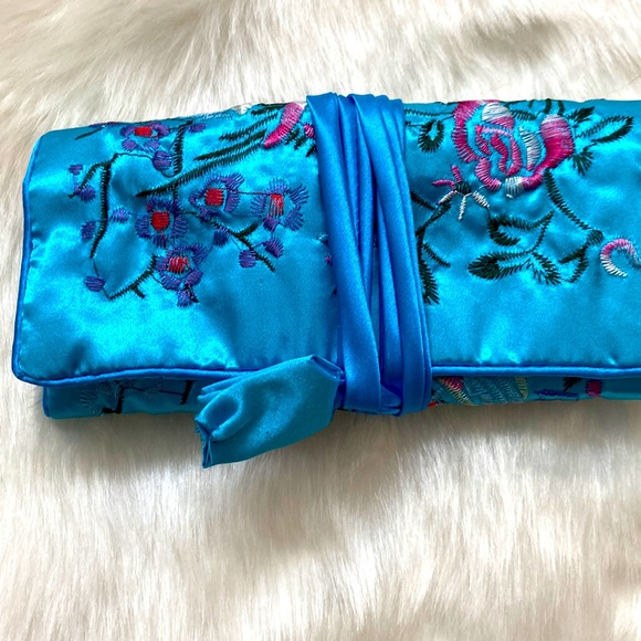 Blue embroidered jewelry roll. - Picture 1 of 4